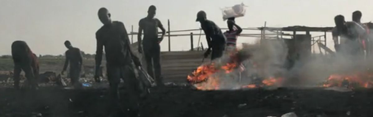 Workers burning harmful waste at the Agobogbloshie dump in Ghana.