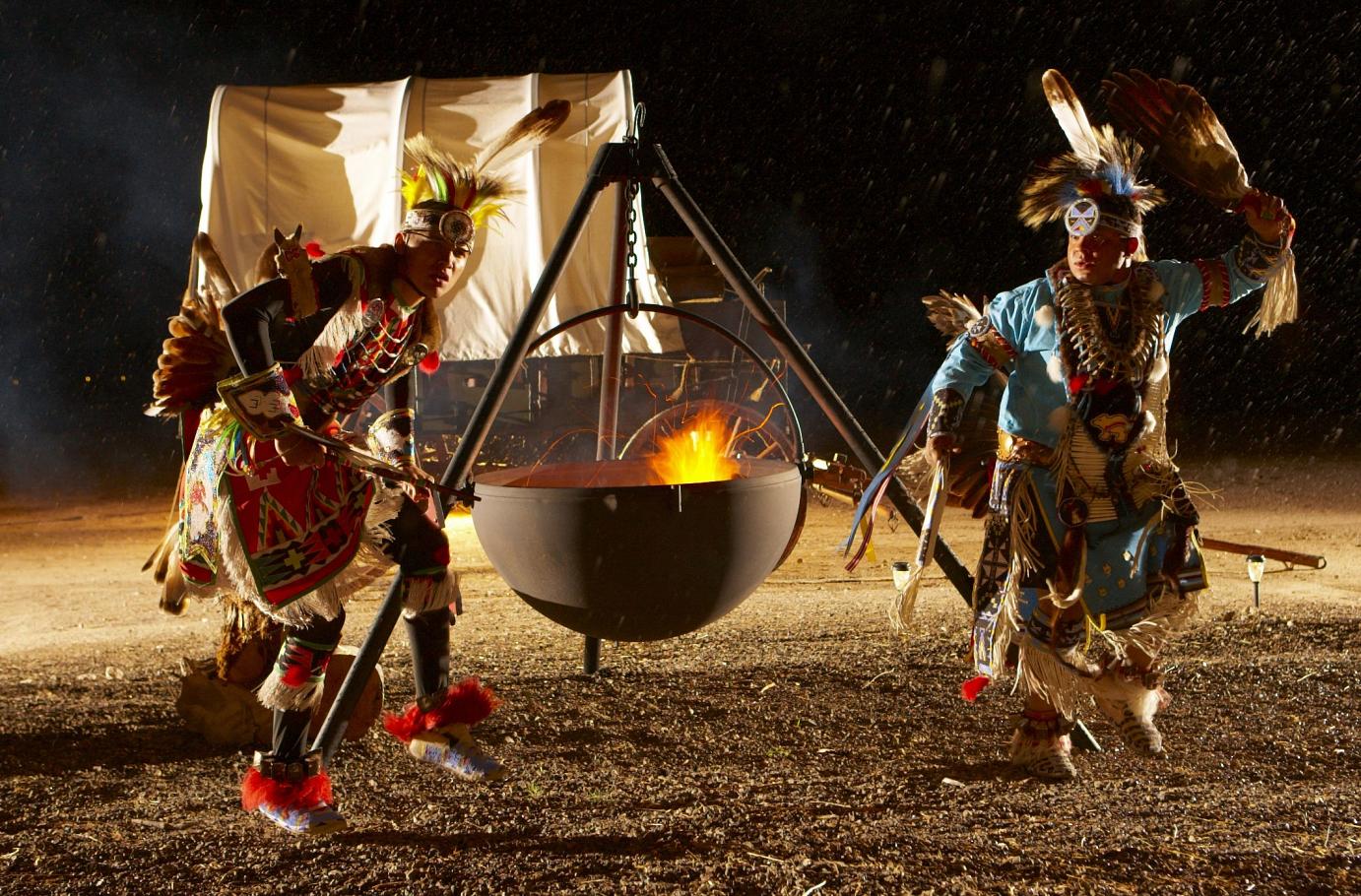 Contagious native dancing around the cauldron.