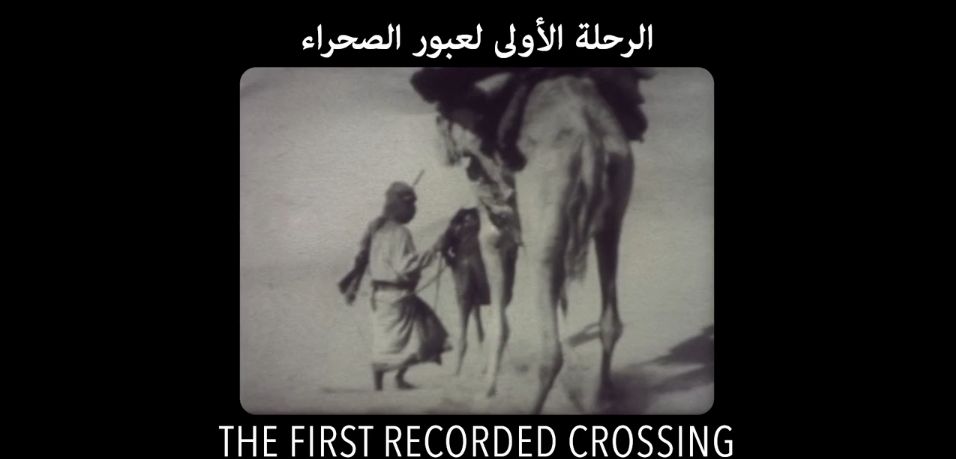 The screenshot showing film footage taken during the first crossing of the Empty Quarter in 1930 showing explorers handling their camels.
