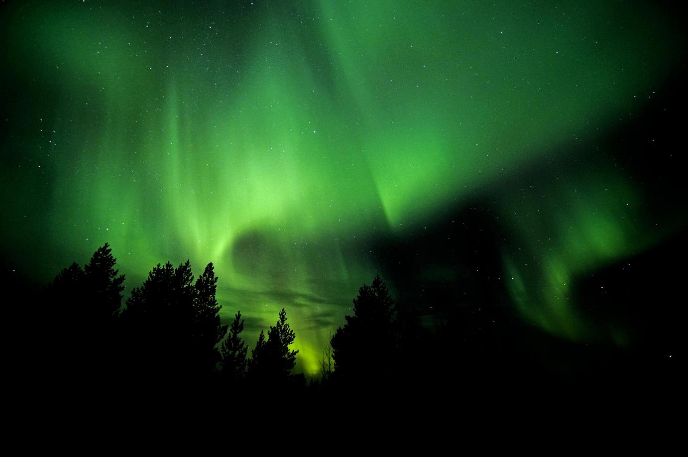 Aurora Borealis. Jukkasjärvi menas 100 days and nights of midnight sun during summer and a fortnight of darkness in winter. Photo credit: Markus Alatalo.